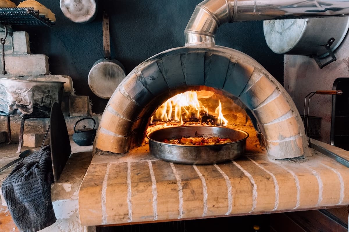 traditional Corfiot meal over a wood-fired oven